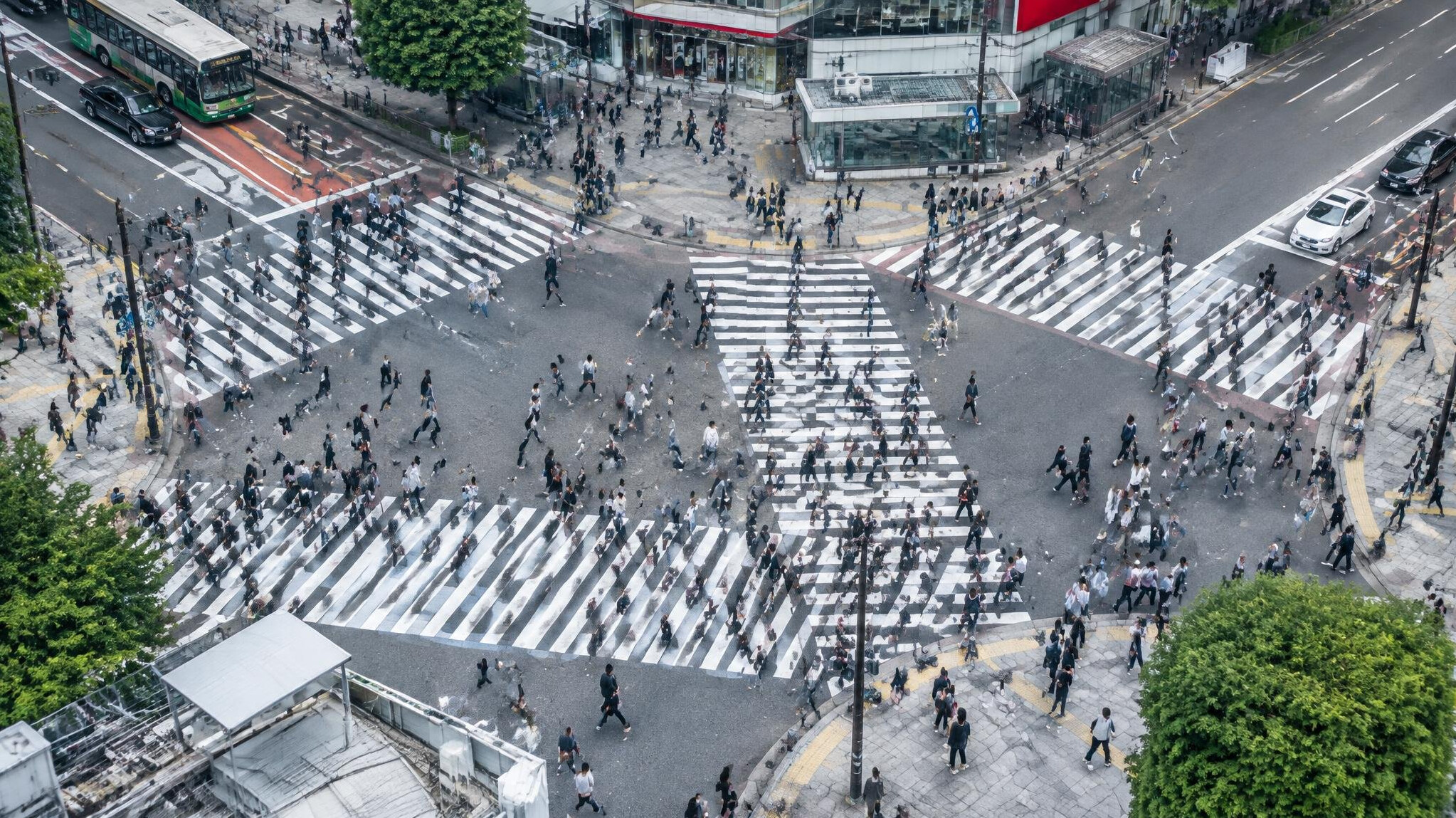 Pedestrian crossing with many people walking in a city